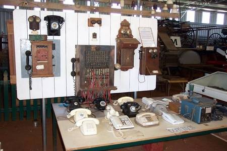 The original Gilgandra Telephone Exchange, with numerous "antique" telephone handsets. - Family Plus Gil 099