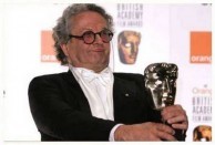 George Miller holds the Award for Animated Feature Film for Happy Feet at BAFTA. 