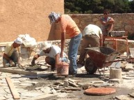 Laying the "coritzo'' tiles in the courtyard of the Kytherian Municipal Library 2 