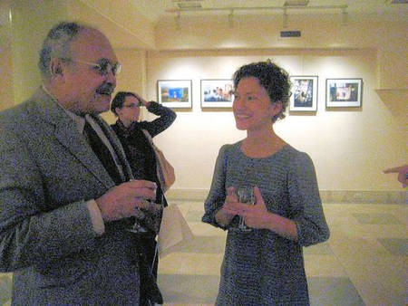 Photographer Kristina Williamson discussing her photographs with John Kassimatis, an American born Greek-American whose father was from Kythera. 