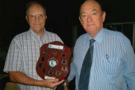 John Prineas and Paul Summers holding the interstate shield 