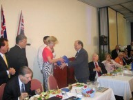 Angelo Notaras presents the Governor of Queensland Ms Quentin Bryce, AC, with all three volumes of the great Hugh Gilchrist's book, Australians & Greeks.. 