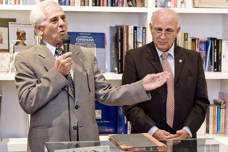 Formal handing over of the first Minute Book (1922) by former President Peter Vanges, to current President, Victor Kepreotis 