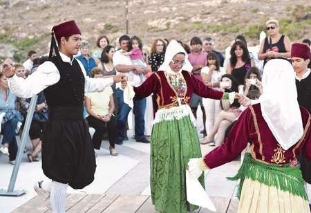 Local children dancing at the ayiasmos at Avlemonas 