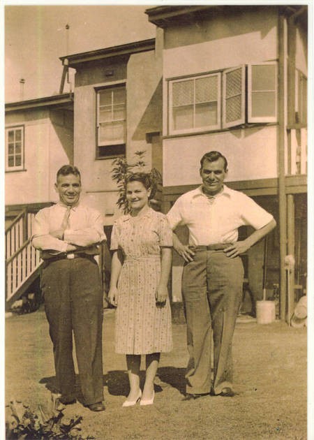 Langley family. Ouside their home. 