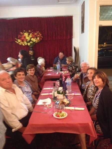 A happy table of friends and guests at the formal dinner to clebrate the Canberra cafe 