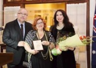 Maria Hill presented with an award by the Greek Ambassador Charalambos Dafaranos and his wife Eva 