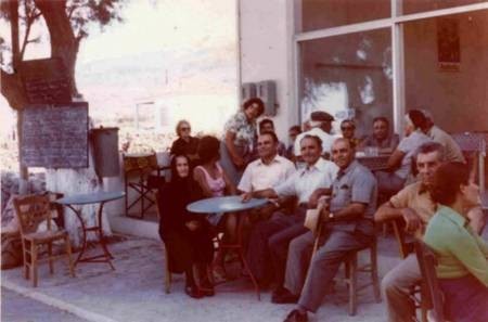 Con George Poulos, at the taverna. With family and friends. 1975. 